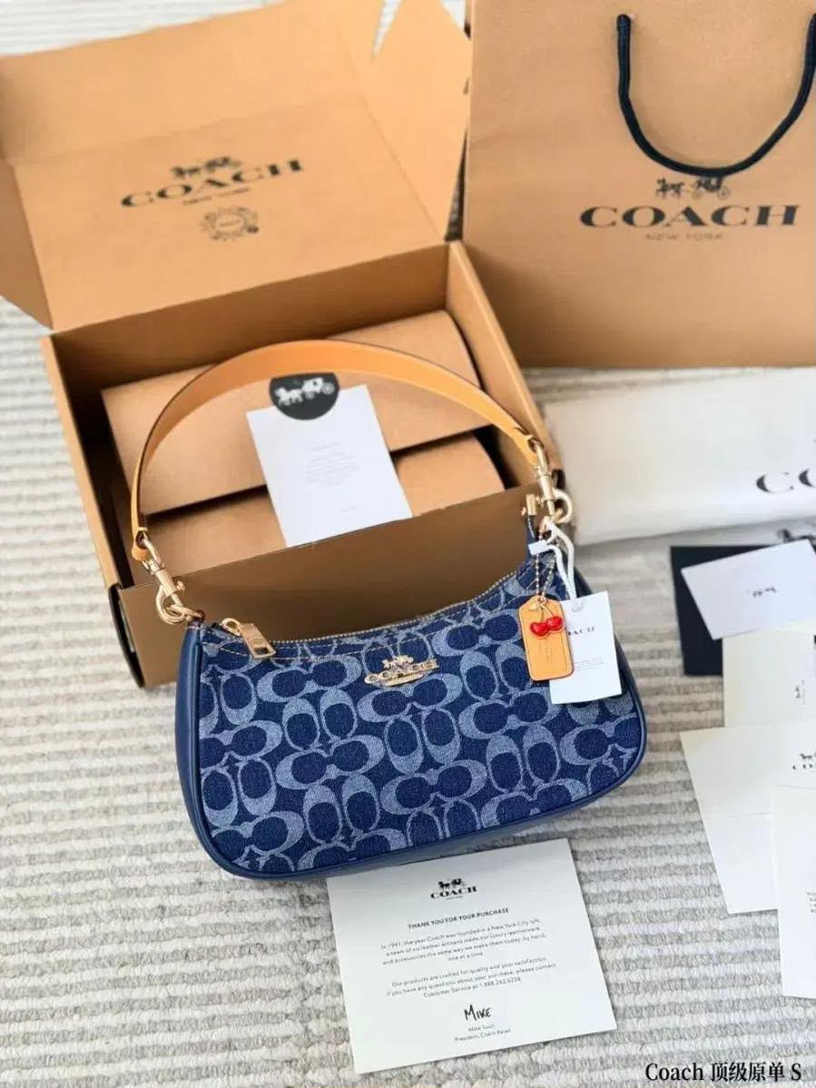 Coach Signature Denim Hobo Bag front view with cherry charm